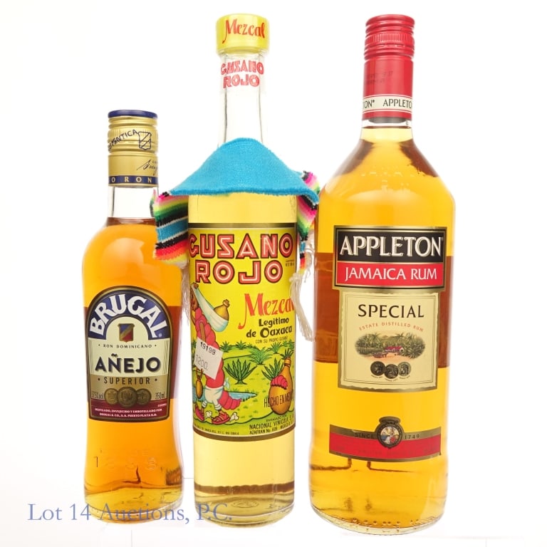Gusano Mezcal, Appleton Rum, and Brugal Rum Lot: Three bottles total in this lot. The first is a bottle of Gusano Rojo Mezcal, 500ml, 38% ABV or 76 proof, Agave worm in bottle. Second is a bottle of Appleton Jamaica Rum, 1L, 80 proof. The third is