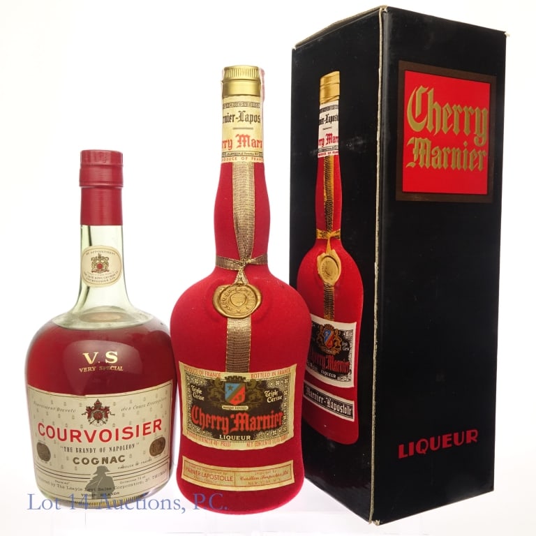 60s/70s Cherry Marnier & Courvoisier: Two bottles total in this lot. The first is a bottle of Red Velvet Cherry Mariner Liqueur, 11/16 quart, 48 proof. Series 112 tax strip, original box included. The second is a bottle of Courvoisier