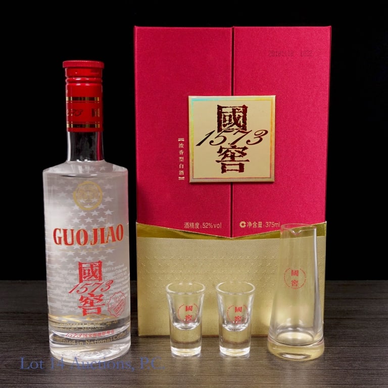 Guo Jiao National Cellar 1573 Gift Set, 375ml: Guo Jiao National Cellar Organic Chinese Baijiu 1573 gift set. Includes one bottle of Guo Jiao, 375ml, 104 proof, along with two small glasses and a slightly larger pouring glass. See photos for