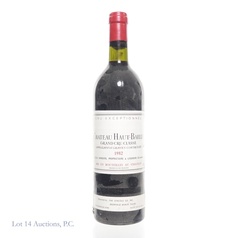 1982 Chateau Haut-Bailly Grand Cru Classe: 1982 Chateau Haut-Bailly Grand Cru Classe; Cru Exceptionnel. 12%abv, 750ml. High shoulder fill. Some residue visible on the neck. Front of bottle has a layer of dust. Bottle was stored horizontally. S