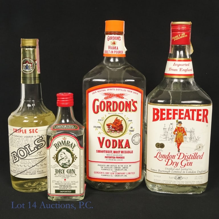 Vintage Gin, Triple Sec, Vodka (2+1+1): Three vintage bottles of liquor. The first is a large bottle of Beefeater London Distilled Dry Gin with a built in pourer. 1.75 L, 94 proof, a low neck fill, and an intact Series 112 tax strip. The se