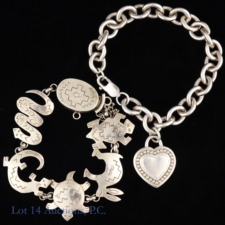 Two Designer Sterling Bracelets (Ripka, Valencia): Two designer bracelets made with sterling silver. The first is a chain bracelet with a heart shaped charm by Judith Ripka. The second is a handcrafted Spirit Animal Bracelet by Navajo artist Anne Vale