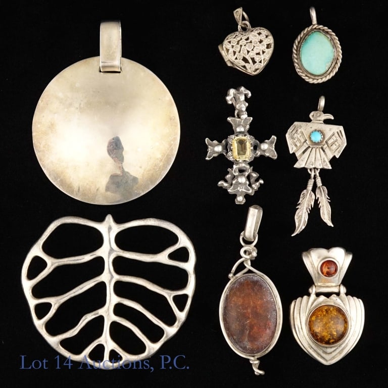 Silver Pendants, Mostly Sterling: Eight silver pendants. Five of them are marked as sterling or 925. Three are unmarked but passed an acid test for silver content. Total weight of lot is approximately 72.66g or 2.33 troy oz.