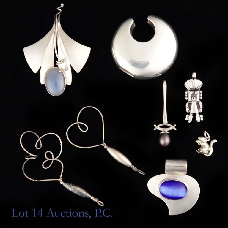 Sterling Silver Pendants: Eight sterling silver pendants of various styles. Total weight of lot is approximately 80.44g or 2.58 troy oz.