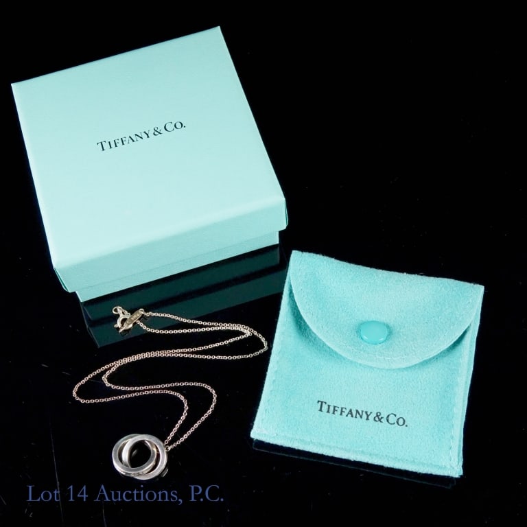 Tiffany Silver 1837 Interlocking Circles Necklace: Tiffany & Co. sterling silver small 1837 Interlocking Circles Pendant. 16" long. With Tiffany & Co. 10/5/2008 gift receipt, original Tiffany bag and box. Lot 14 guarantees the authenticity of this nec