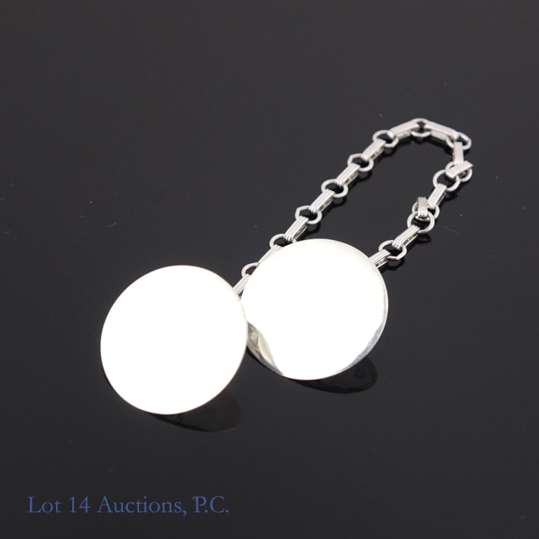 Tiffany & Co Sterling Silver Sweater Clips: Set of sterling silver circular sweater clips connected by a short chain by Tiffany & Co. The monogram has been polished off by a professional jeweler, leaving the clips blank. See photos for details.