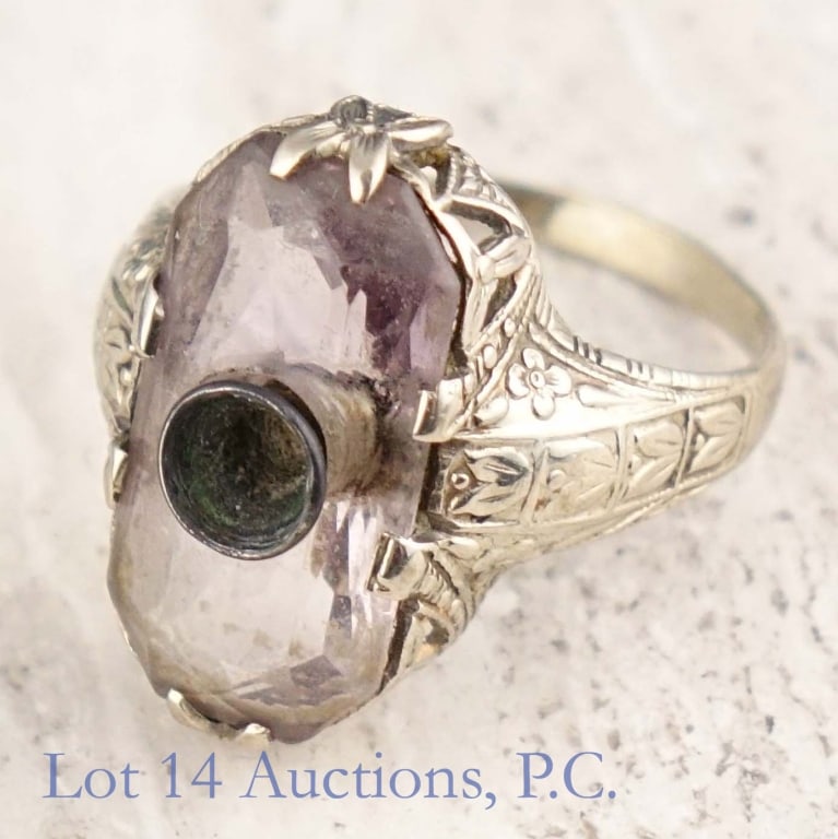14k White Gold Ring w/ Amethyst: Size 5.5 ring made with 14k white gold with a large amethyst stone. The amethyst has a hole in the center with a setting for another stone, which is missing. Ring weighs approximately 3.42g or 0.11