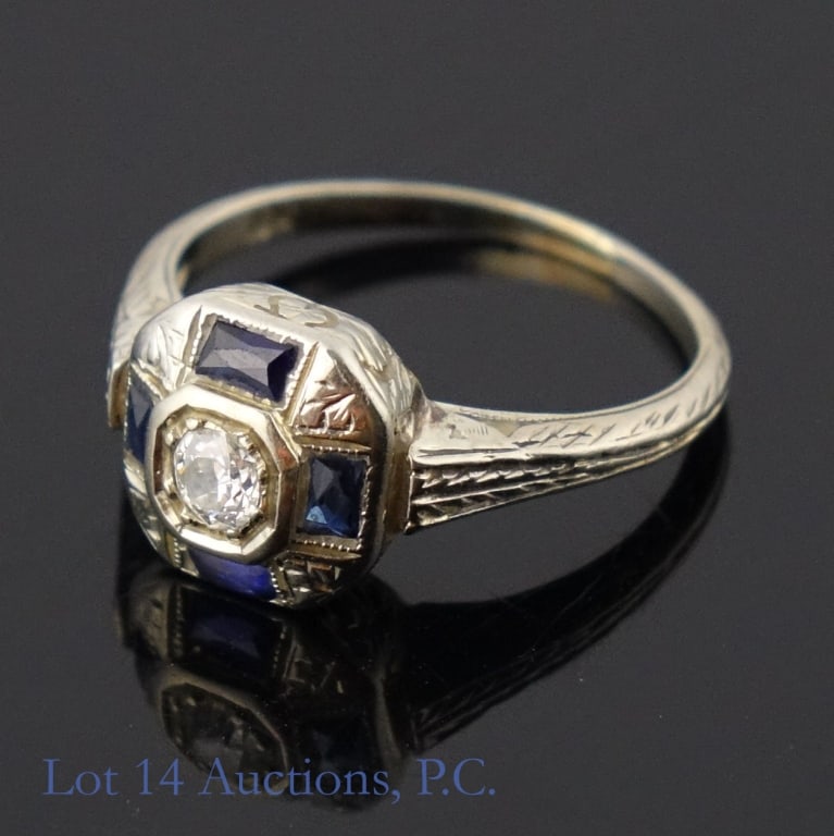 14k White Gold Ring w/ Precious Stones: Size 4 ring made with 14k white gold. The white stone in the center electronically tested as ruby, sapphire, or topaz, and the blue stones surrounding it tested as chrysoberyl, spinel, or topaz. See p