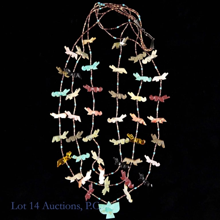 Native American Three Strand Fetish Necklace: Native American, likely Navajo or Zuni, three strand fetish necklace. Featuring beads and various hand carved animal figures with central bird fetish at the bottom of the longest strand. Very good