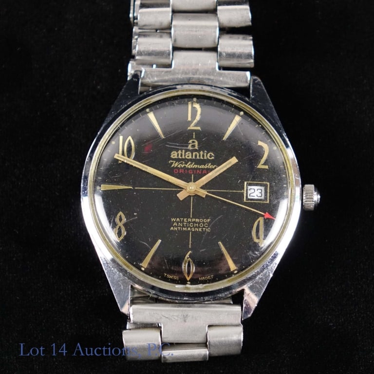 1960s/70s Atlantic Worldmaster Wrist Watch: 1960s / 1970s Atlantic Worldmaster. Black dial with applied gold tone numeral and stick markers, and date window at 3 o'clock. Stainless steel case and bracelet. Swiss made. Case diameter approximatel