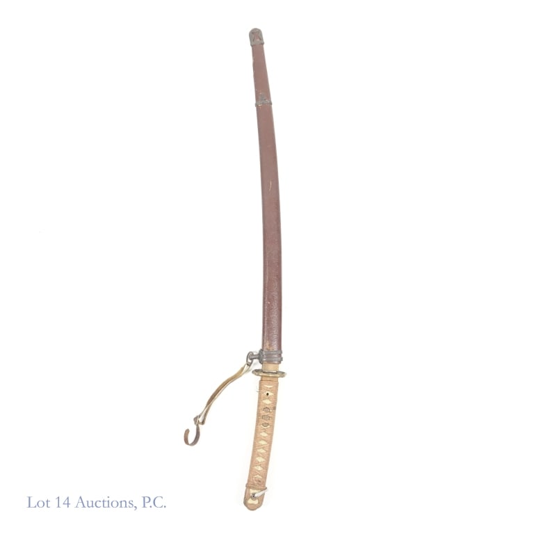 Type 98 Shin Gunto WWII Japanese Military Sword: Type 98 Shin Gunto World War II Japanese military sword with original leather wrapped Saya scabbard. Hilt features traditional Tsuka wrap over ray skin. Mekugi bamboo pin securing the handle to the bl