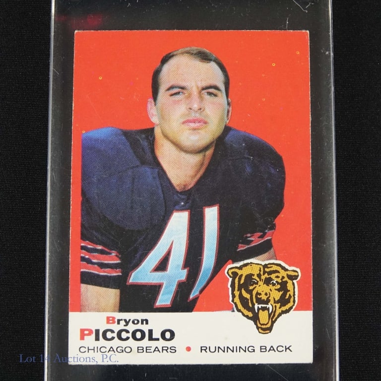 1969 Topps #26 Brian Piccolo Rookie Football Card: 1969 Topps football #26 Brian Piccolo rookie card (note that both front and back of the cards have uncorrected spelling errors of his name). Card is in above average condition. Some corner wear. 4 sma