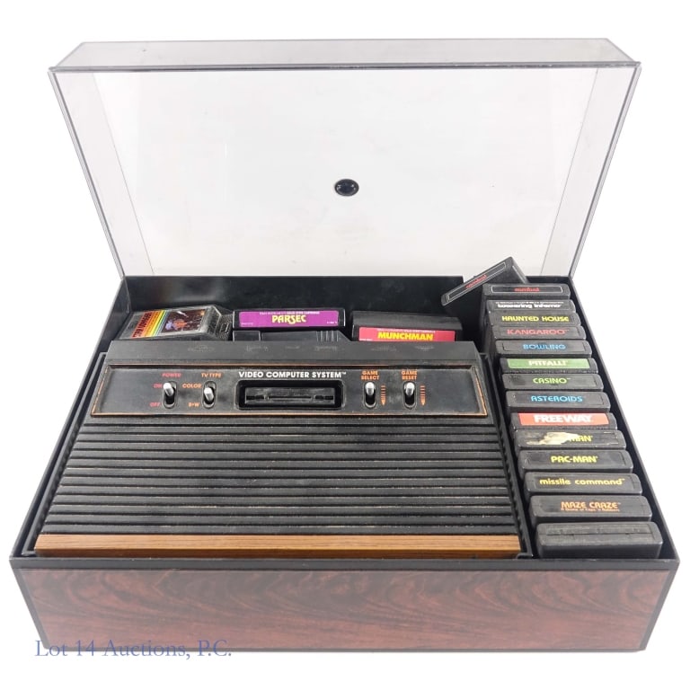 Atari 2600 Console, Cartridges, Manuals, Storage *: Atari CX2600 console, original power adapter, plastic storage case with lid, two (2) game catalogs, console manual, twenty three (23) game manuals, and nineteen (19) cartridges - Riddle Of The Sphinx,