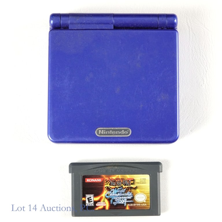 Nintendo Game Boy Advance SP + Yu-Gi-Oh Game (T+W): Blue Nintendo Game Boy Advance SP with Yu-Gi-Oh World Championship Tournament 2004 game. Charger is not included. Tested and working.