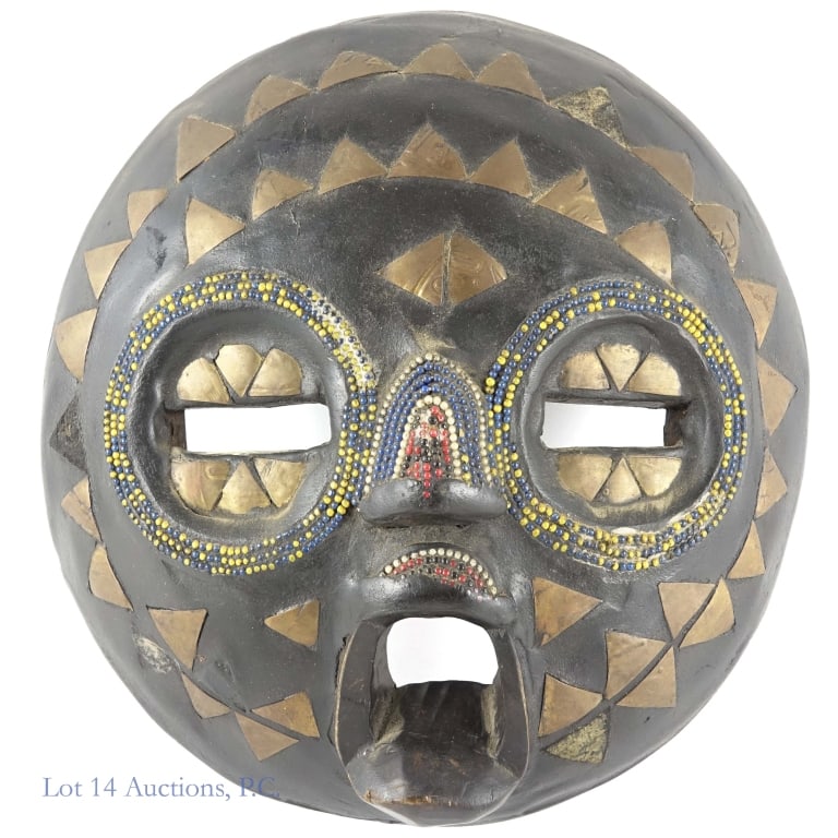 Ashanti Baluba Moon Mask (Ghana) W. Africa: Baluba Moon Mask - made by an Asante / Ashanti artisan in Ghana. Hand carved wood embellished with triangular brass and glass beads. There appear to be 3-4 brass triangular pieces absent. Elliptical d