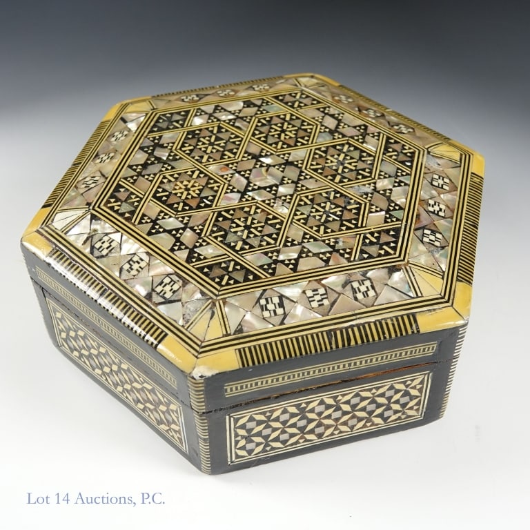 Egyptian Hexagonal Trinket Box: Egyptian style hexagon shaped wooden trinket / jewelry box decorated with inlaid bone and mother of pearl. Measures approximately 7 x 7 x 2.75". Red velvet interior. Appears to be in good condition
