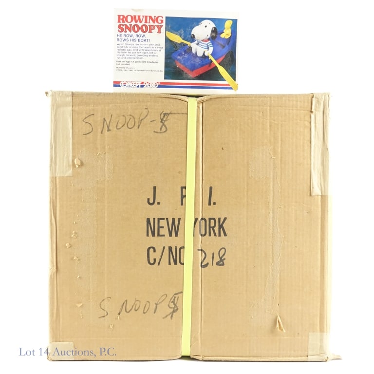 1972 Rowing Snoopy Toy (NOS Case of 12): Factory banded case of 12 Rowing Snoopy battery operated toys (snoopy rows the boat while Woodstock looks out from the bow). Case is sealed with original paper tape and still plastic banded and full