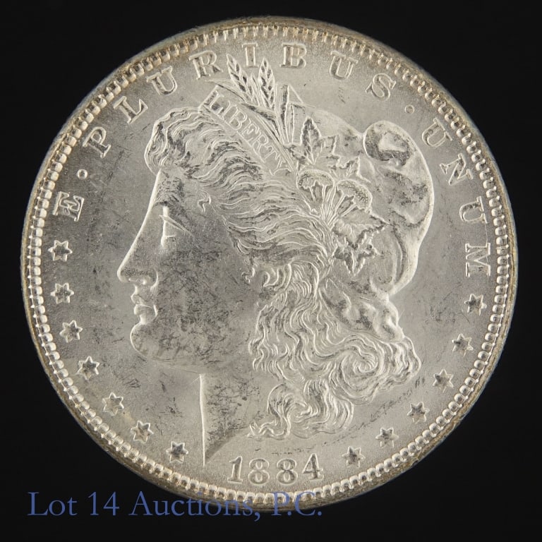 1884 (P) US 90%-Silver Morgan Dollar (BU): 1882 (P) United States silver Morgan dollar (Philadelphia Mint). Per consigner, in BU condition. Metal is 90% silver (ASW 0.7734 ozt). Mintage 14,070,000. *** Lot 14 Auctions is not a professional num