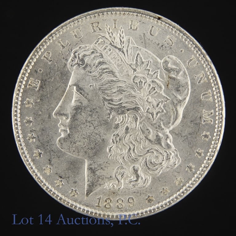 1889 (P) US Silver Morgan Dollar (*BU): 1889 (P) United States silver Morgan dollar (Philadelphia Mint). *Per consigner, original surfaces in BU condition. Greysheet wholesale price guide value at MS-63 $90. *** Lot 14 Auctions is not a pro