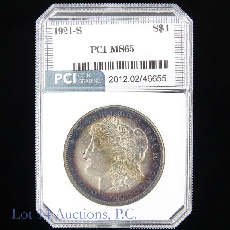 1921-S US Silver Morgan Dollar (PCI): 1921-S United States silver Morgan dollar (San Francisco Mint). PCI slabbed MS65 with obverse toning around edge. Metal is 90% silver. Silver content confirmed on Lot 14 Auctions electronic metal veri