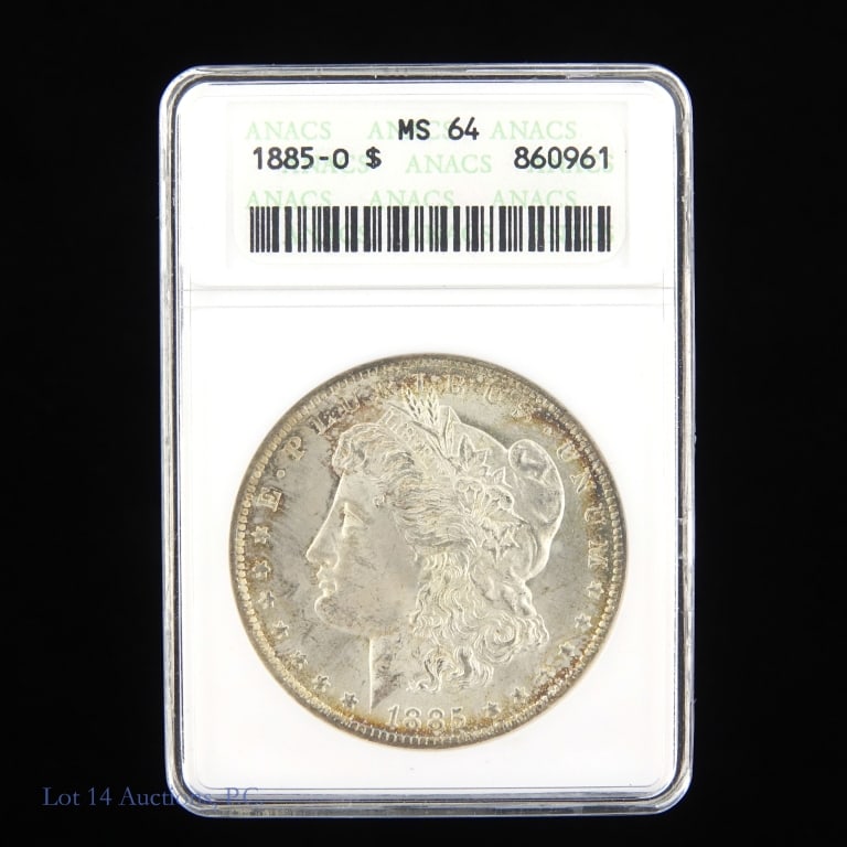 1885-O Silver Morgan Dollar (ANACS MS64): 1885-O United States silver Morgan dollar (New Orleans Mint). Earlier ANACS graded MS64 with slight toning around edges. Metal is 90% silver. Mintage 9,185,000. Greysheet wholesale price guide value a