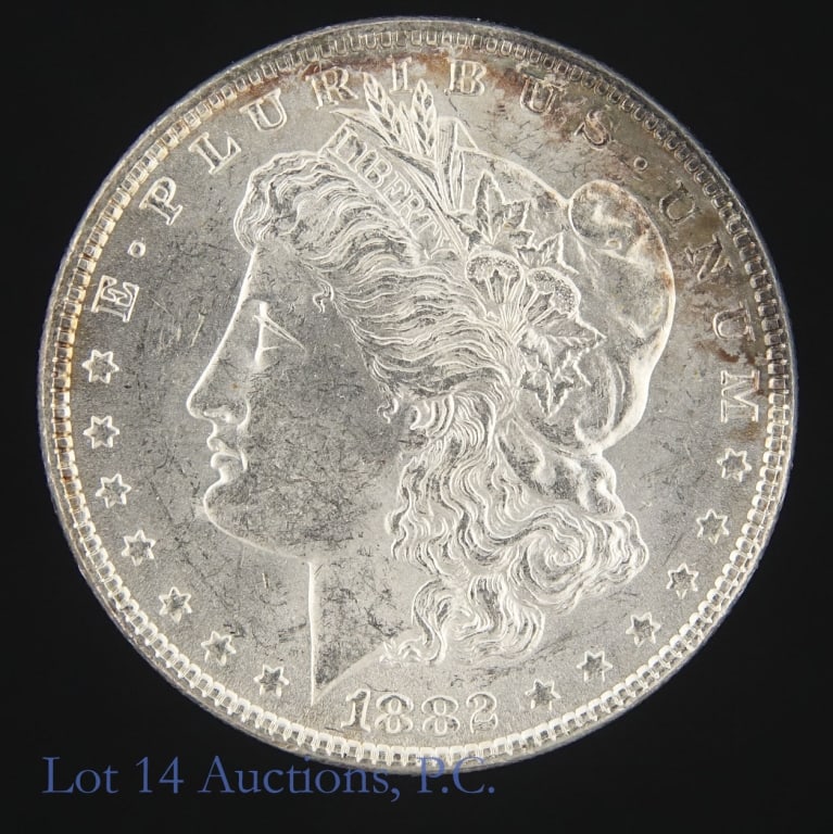 1882 (P) US Silver Morgan Dollar (*BU): 1882 (P) United States silver Morgan dollar (Philadelphia Mint). Per consigner, good original luster with slight toning in BU condition. Metal is 90% silver (ASW 0.7734 ozt). Mintage 11,100,000. *** L
