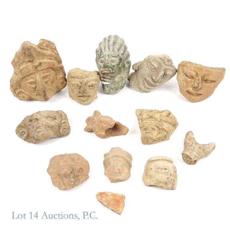 Pre-Columbian Pottery/Stone Heads / Faces (12): Twelve (12) pottery or carved stone heads / faces. Per consigner, all are pre-Columbian American in origin. One freestanding upright piece (black / green stone) measures approximately 3" tall with a 1