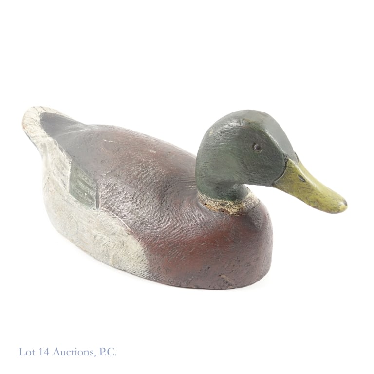 Frank Schmidt Mallard Drako Decoy: Mallard Drako wooden decoy by Frank Schmidt. Approximately 18.5" long x 7.25" wide x 7" tall. Weight: 2.9 pounds. Some signs of wear. Damage around neck appears to have been repaired.