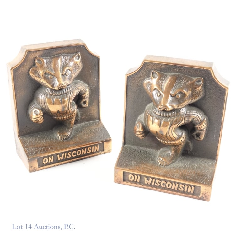 1980 U Wisconsin Bucky Cast Iron Bookends (pr): Pair of cast iron bookends (finish appears a copper color) featuring the University of Wisconsin's Bucky Badger and the words "On Wisconsin". Inside of bookends are embossed "11/24/80". Each book end