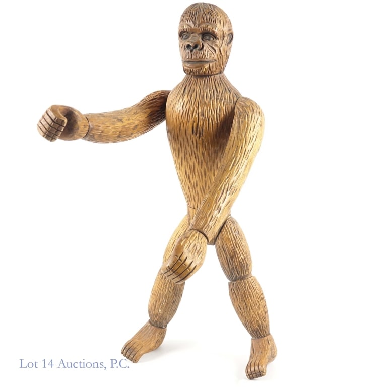 Hand Carved (?) Articulated Wooden Monkey: Articulated wooden monkey (we believe this is hand carved). Head turns, hands turn at wrist, arms bend at shoulders, body turns at waist. Knees bend. Feet turn at ankle. Approximately 23.5" tall. It