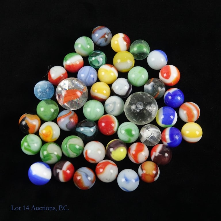 Vintage Marbles - Assorted - 9.6 Ounces: 9.6 ounces of vintage marbles. Shooters appear fractured, but no damage can be felt on exterior. Please see photos for details.