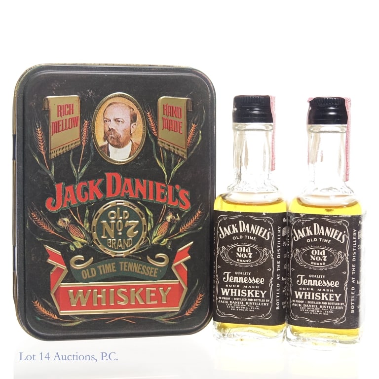 60s/70s Jack Daniel's Mini Bottles, Tin Box: Two (2) Jack Daniel's mini bottles in a Jack Daniel's branded decorative tin box. 60s/70s tax strips fully intact. 90 Proof, 2 x 1/10 Pint. Tin box shows some rust, but is in overall good shape.