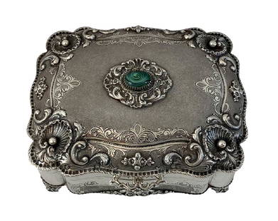 Antique European 800 Silver Gem Inlaid Jewelry Box: Antique European silver hinged footed jewelry box inlaid with an oval Malachite gemstone to top and crafted with a beautiful ornate repousse floral design throughout. Marked 800 to bottom. Circa: