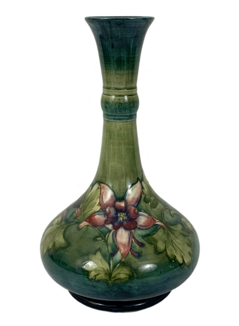 Antique William Moorcroft Art Nouveau Pottery Vase: William Moorcroft (1872-1945) Art Nouveau floral glazed art pottery vase. Hand & incised signatures to base. Made in England. Measures: 12-3/8” Tall x 7” Diameter. From a Stuart, FL estate. Local 