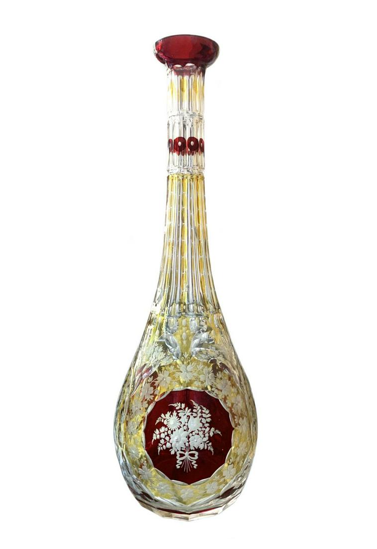 Victorian French Cranberry Crystal Cherub Decanter: Antique French cut crystal decanter beautifully crafted with an etched floral & cherub motif along body featuring cranberry & gold accents throughout. Circa: Turn of the Century. Measures: 14" Tall x 