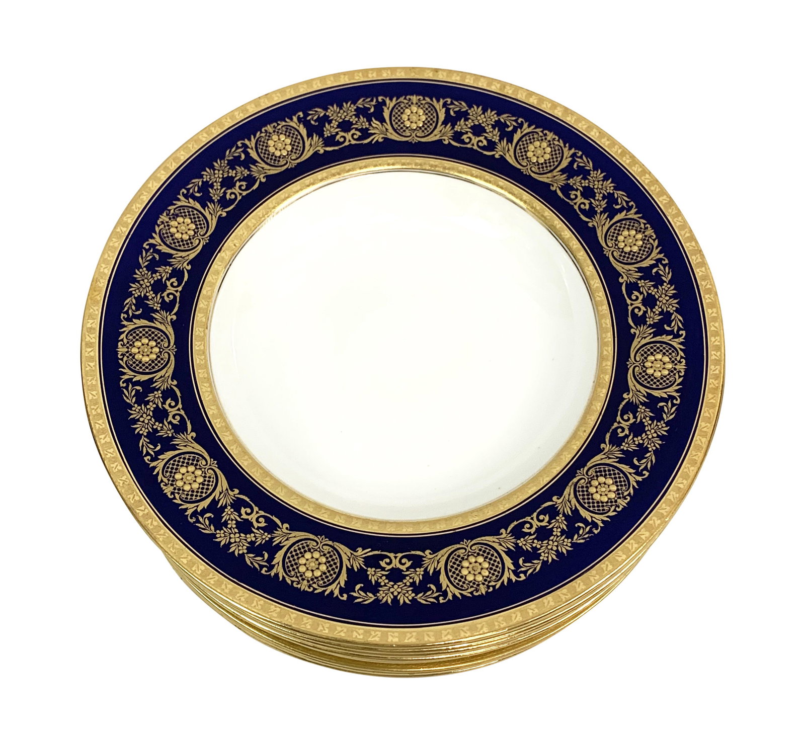 Minton Ovington English Cobalt Gold Soup Bowls: Collection of nine (9) Minton Ovington porcelain soup bowls crafted with a beautiful gilt design over cobalt blue borders. Each stamp marked to base. Each measures: 9" in Diameter. From a Palm Beach e