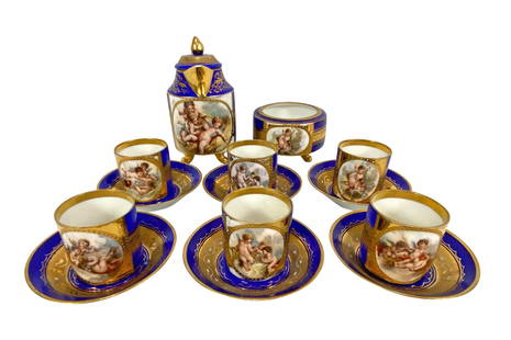 Antique Royal Vienna Miniature 14pc Coffee Set: Antique Royal Vienna hand painted porcelain miniature cobalt blue coffee set featuring cherub scenes and gilt tri throughout. Circa: 19th Century. Set to include: six (6) cups, six (6) saucers, sugar