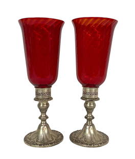 Pair of Antique Gorham Sterling & Ruby Glass Vases: Pair of antique Gorham English sterling silver and ruby glass swirl vases/candle holders. Marked "Gorham Sterling" to base. Each measures approx. 12-3/4" Tall x 4-3/4" in Diameter. Total collective