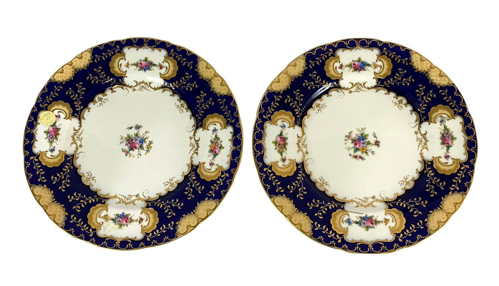 Pair of Minton "Ryrie Birks LTD" Chargers/Plates: Pair of Mintons English hand painted porcelain gilt and cobalt blue floral dinner plates/chargers. Circa: Turn of The Century. Marked "Mintons England Ryrie - Birks Ltd Toronto". under glaze to base. 