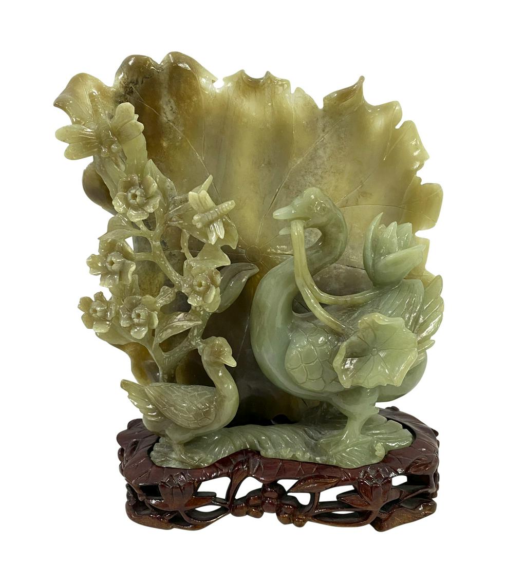 Chinese Hand Carved Jade Sculpture on Wooden Base: Chinese hand carved jade sculpture of ducks, butterfly and flowers on lily pad atop fitted wooden base. Measures: Local Pick Up or Third Party Shipping Required.