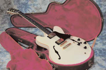 ** Status Quo - Francis Rossi owned Gibson 335: This is a white Gibson 335 guitar bearing the serial number 83398533 together with copies of the original bill of sale from Rossi to the current vendor. Also included is a hard case for the guitar.