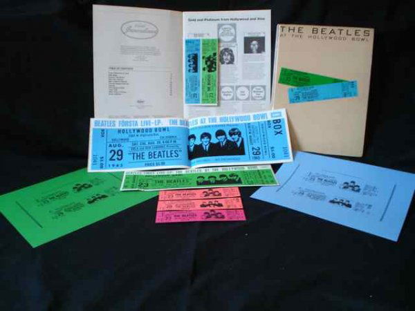 Beatles at the Hollywood Bowl Items: Beatles at the Hollywood Bowl Items A collection of promotional items including promotional stickers, mock tickets (unusually in pink and cerise) uncut promotional ticket sheets and a Warner Bros. 197