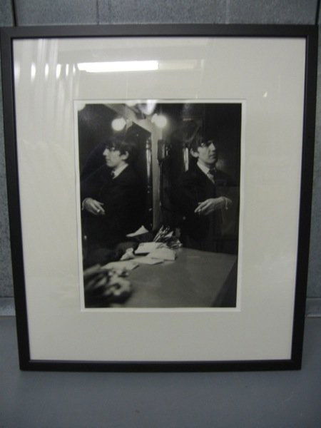 Beatles A photographic print of George Harrison: Beatles A b/w photographic print of George Harrison 1963 – Signed by photographer Jane Brown Framed and Glazed.