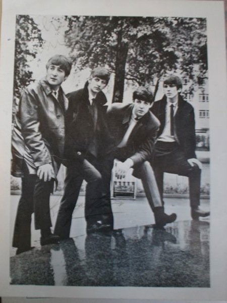 Beatles signed photograph: A Black and white 6x8" publicity photograph depicting al four Beatles signed in black ink by Ringo Starr and John Lennon. Both signatures are clearly visible but suffering from fading.