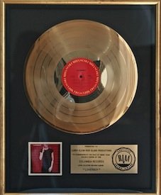 Loverboy RIAA Record Award: Loverboy RIAA Record Award. Presented to Larry Klein-Dick Clark Production to commemorate the sales of over 500,000 copies of the Columbia Lp “Loverboy’’. 17” x 21”Estimate £100/150 Loverbo