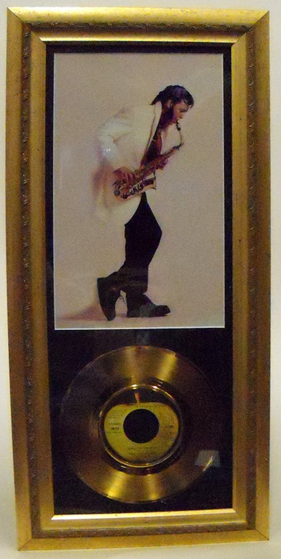 Paul McCartney/Wings Gold Single Award: Paul McCartney/Wings. 45 Gold Single Award for the best selling hit ‘Band on the Run’. in house presentation including a rare photo of Paul McCartney playing the saxophone. Framed and matted Estim