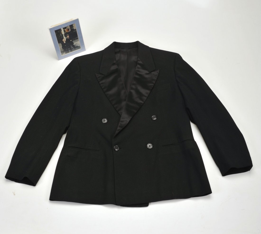 John Lennon’s jacket: John Lennon’s jacket. Accompanied by a photo. John Lennon Dinner Jacket A bespoke tailored double breasted dinner jacket manufactured by Kabom tailors owned and worn by John Lennon during 1975. The 