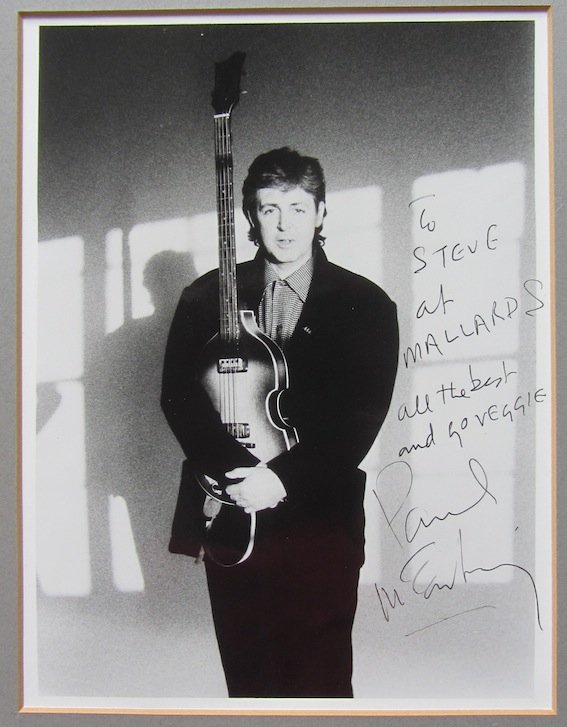 Paul McCartney. A mounted 8 x 10 black and white: Paul McCartney. A mounted 8 x 10 black and white photograph with a written dedication in black biro“to Steve at Mallards, all the best and go veggie! Paul McCartney