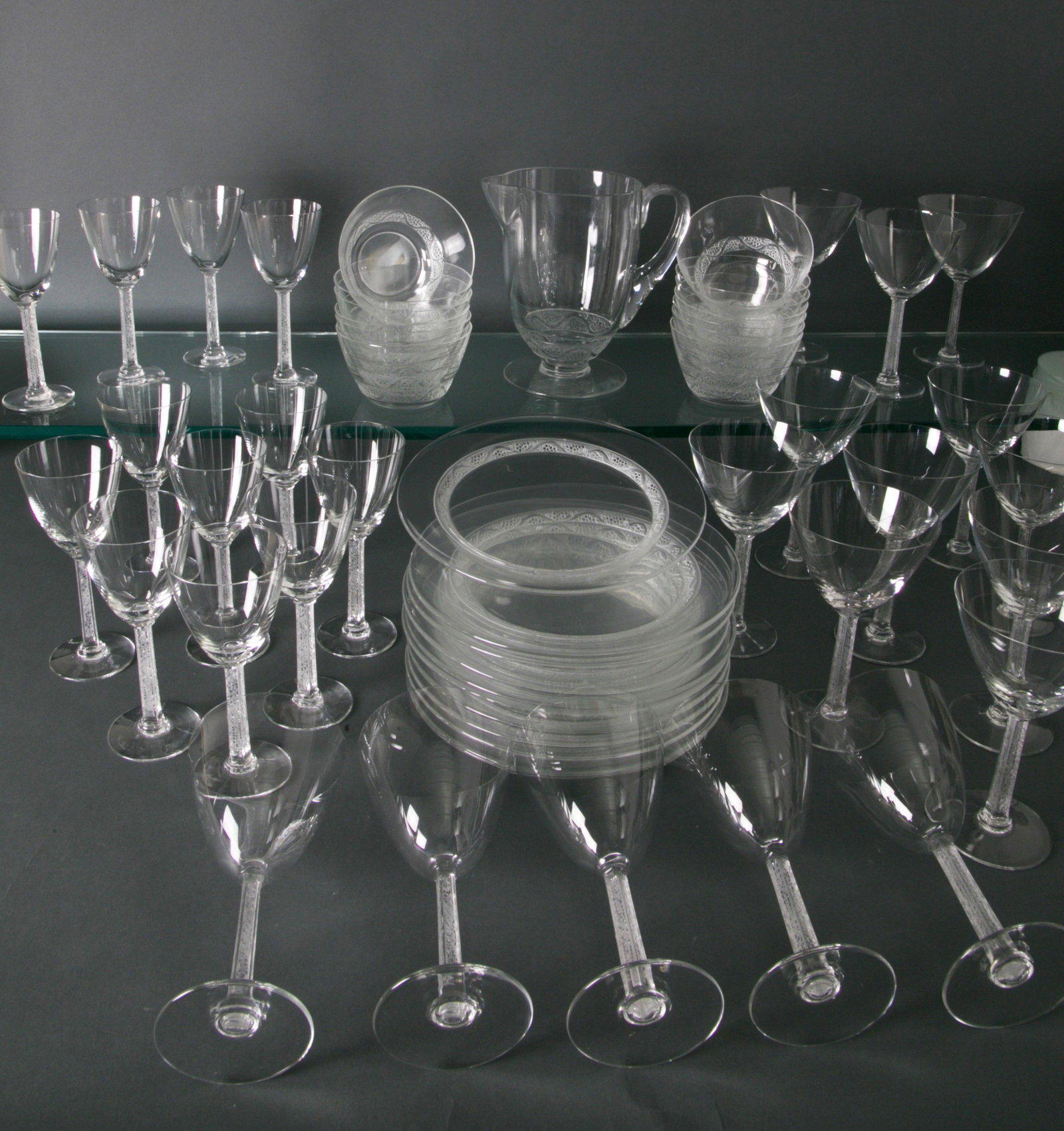 55 Piece Set of Rene Lalique Glass Phalsbourg Pattern: 5 piece Set of Lalique Glass In The Phalsbourg Pattern, circa 1933,circa 1933, René Lalique, comprising of 11 plates, 13 finger bowls, 10 goblets, 12 wine glasses, 3 sherry glasses, 5 red wine goblet