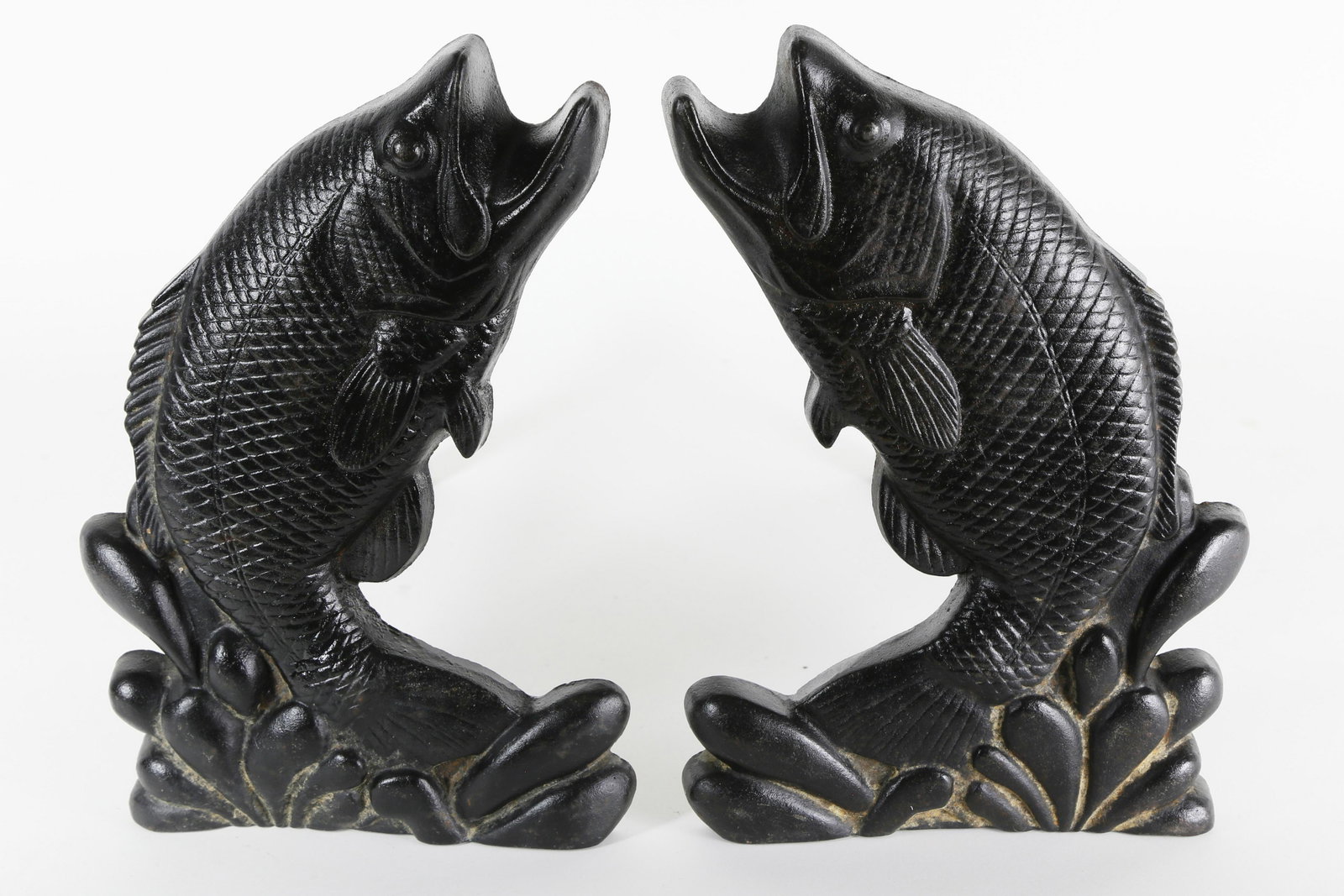 Pair of Cast Iron Jumping White Bass Andirons, c. 1900: Pair of Cast Iron Jumping White Bass Andirons, circa 1900, two trout splashing out of the water, each marked with #1 and #2 on reverse. Height 12 in.